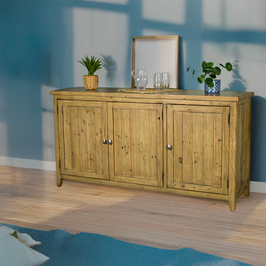 An overall view of the Cairns Recycled Pine Buffet. There are two small potted plants on top on either side, inbetween a small pitcher of water and two glasses.