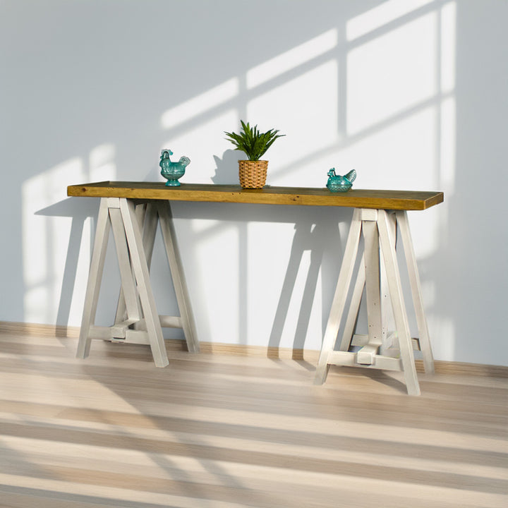 Front view of the Large Byron Recycled Pine Sofa Table. There is a potted plant and two blue glass ornaments on top.