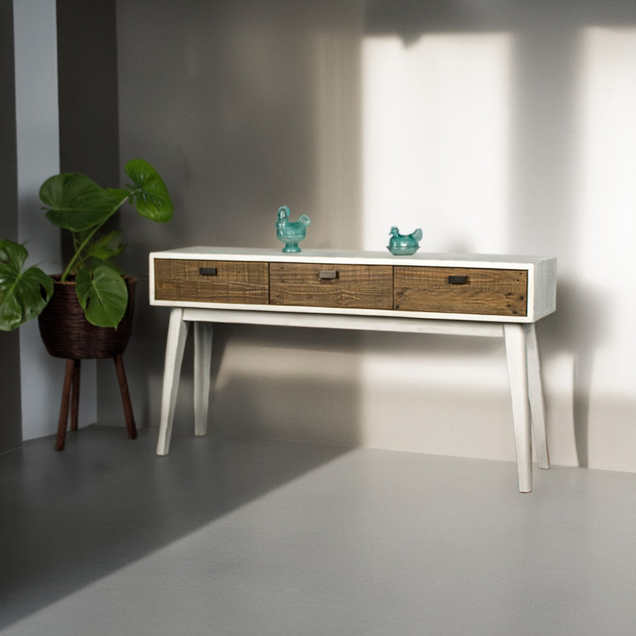 Front of the Nova Recycled Pine Console Table with three drawers. There are two blue glass ornaments on top.