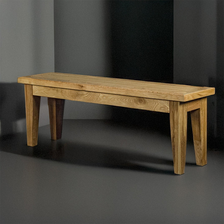 The front of the Oscar Solid Oak Bench 1.4m.