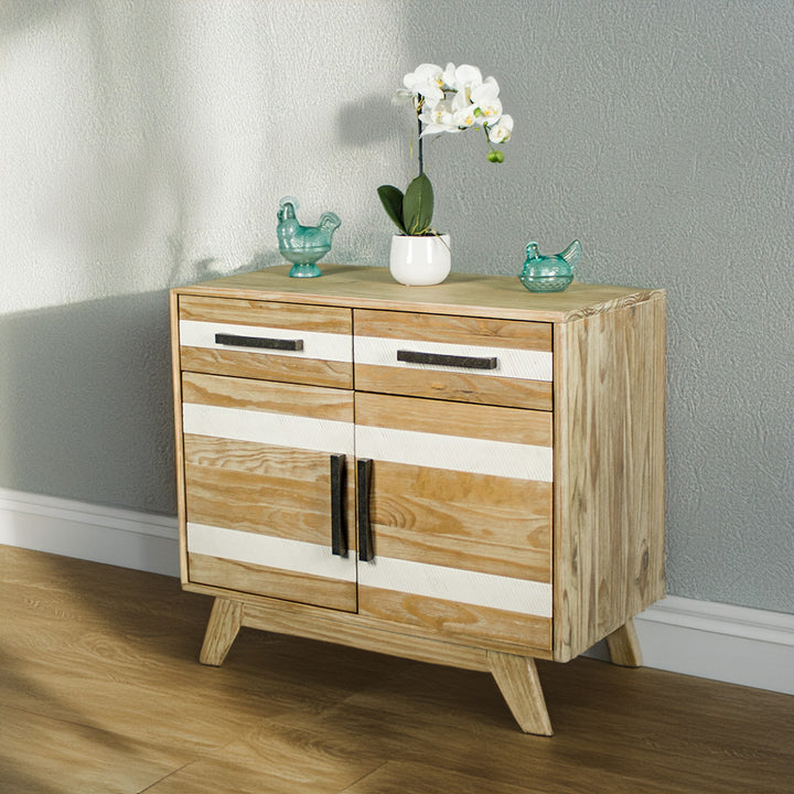 The front of the Soho 2 Door 2 Drawer NZ Pine Buffet Sideboard. There are two blue glass ornaments on top with a pot of white flowers in between.