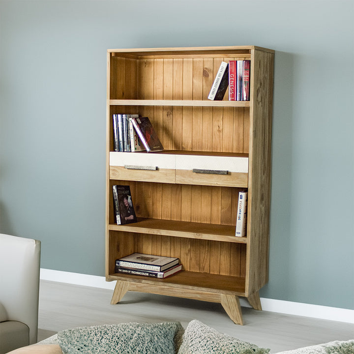 The front of the Soho Medium Bookcase. There are books on each shelf.