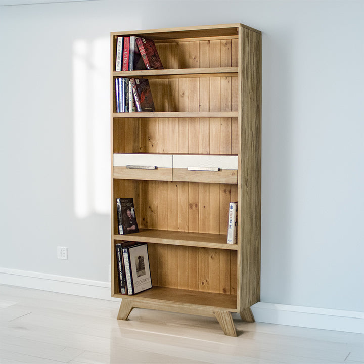 The front of the Soho Tall Bookcase. There are books on each shelf.