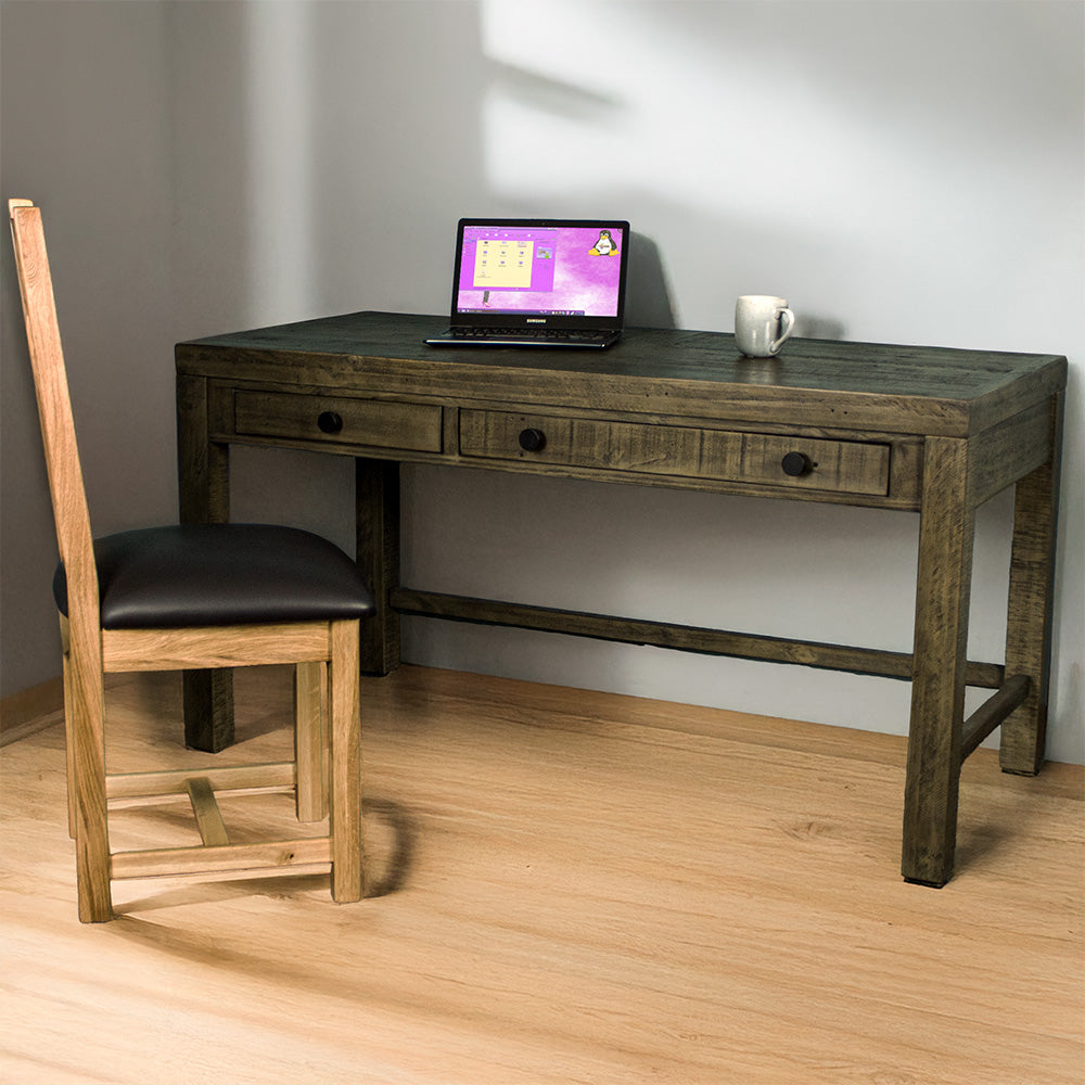 Front of the Stonemill Recycled Pine Desk. There is an oak leather chair in front and a laptop and coffee mug on top.