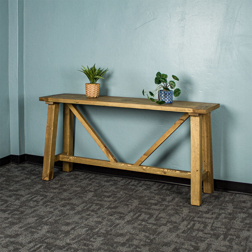 Front of the Ventura Recycled Pine Hall Table. There are two potted plants on top.