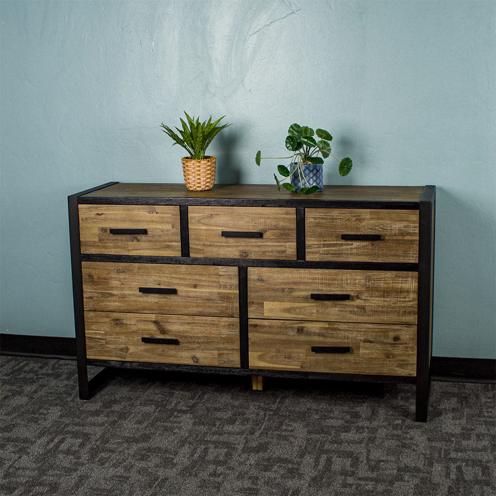 Front of the Victor 7 Drawer Lowboy. There are two potted plants on top.