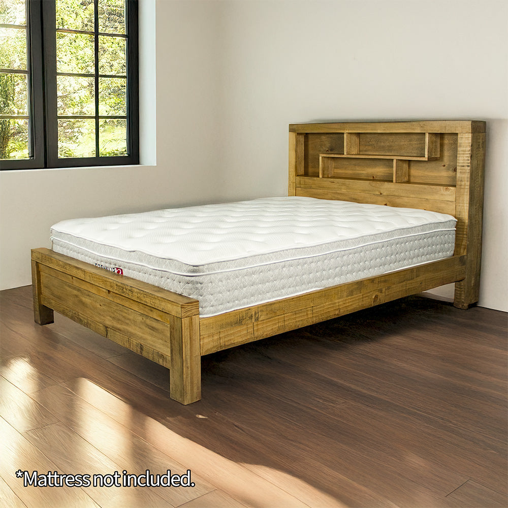 The front of the Amarillo King Slat Bed Frame, with a mattress on top inside of a cozy modern bedroom.