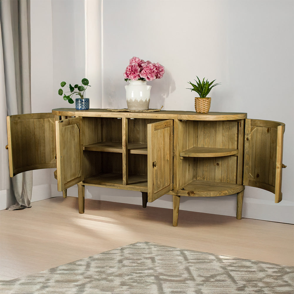 The front of the Buffalo Recycled Pine Curved Buffet, with its doors open. There are three potted plants on top with a rattan leaf in the middle.