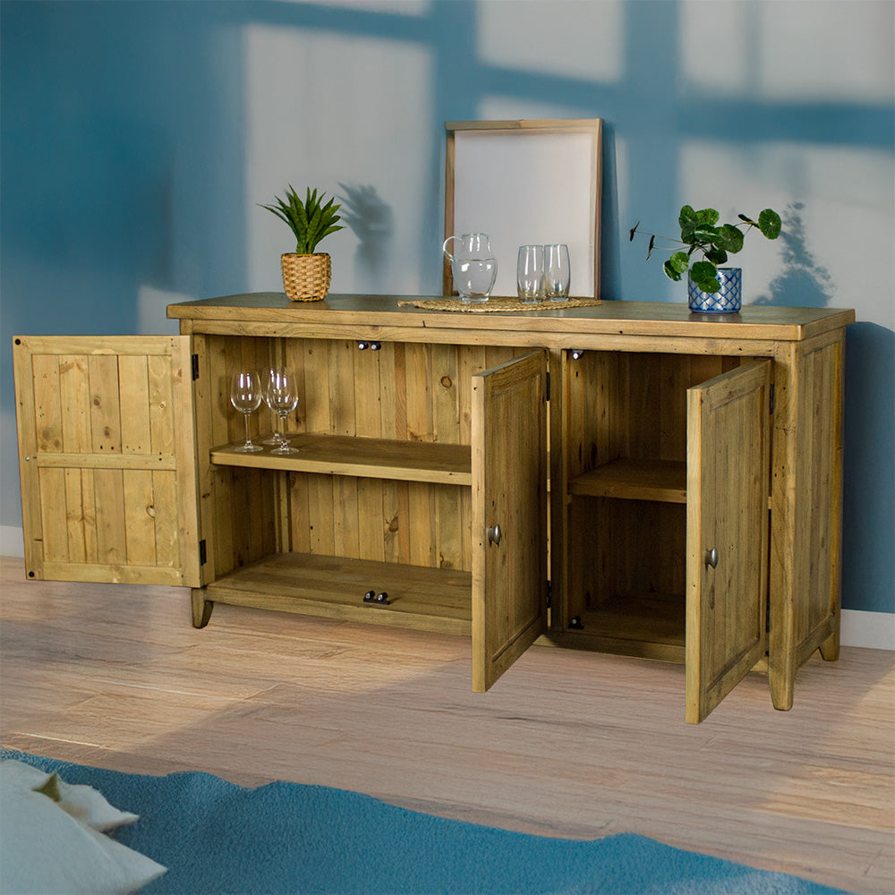 An overall view of the Cairns Recycled Pine Buffet with its doors open. There are two small potted plants on top on either side, inbetween a small pitcher of water and two glasses.