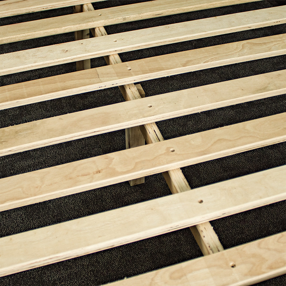 A close up of the slats and wooden support bar of the Mars Double Slat Bed Frame.