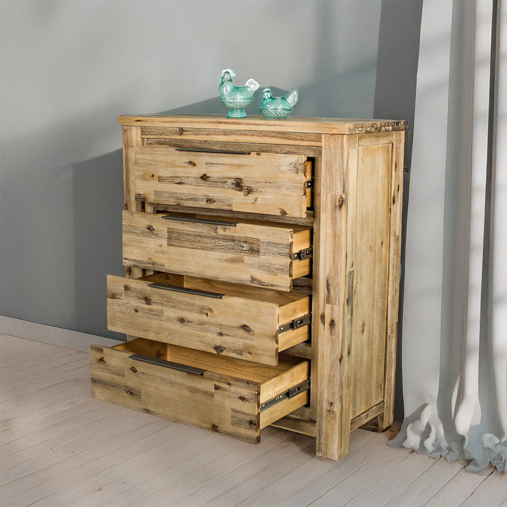 The front of the Mars Four Drawer Tallboy with its drawers open. There are two blue glass ornaments on top.