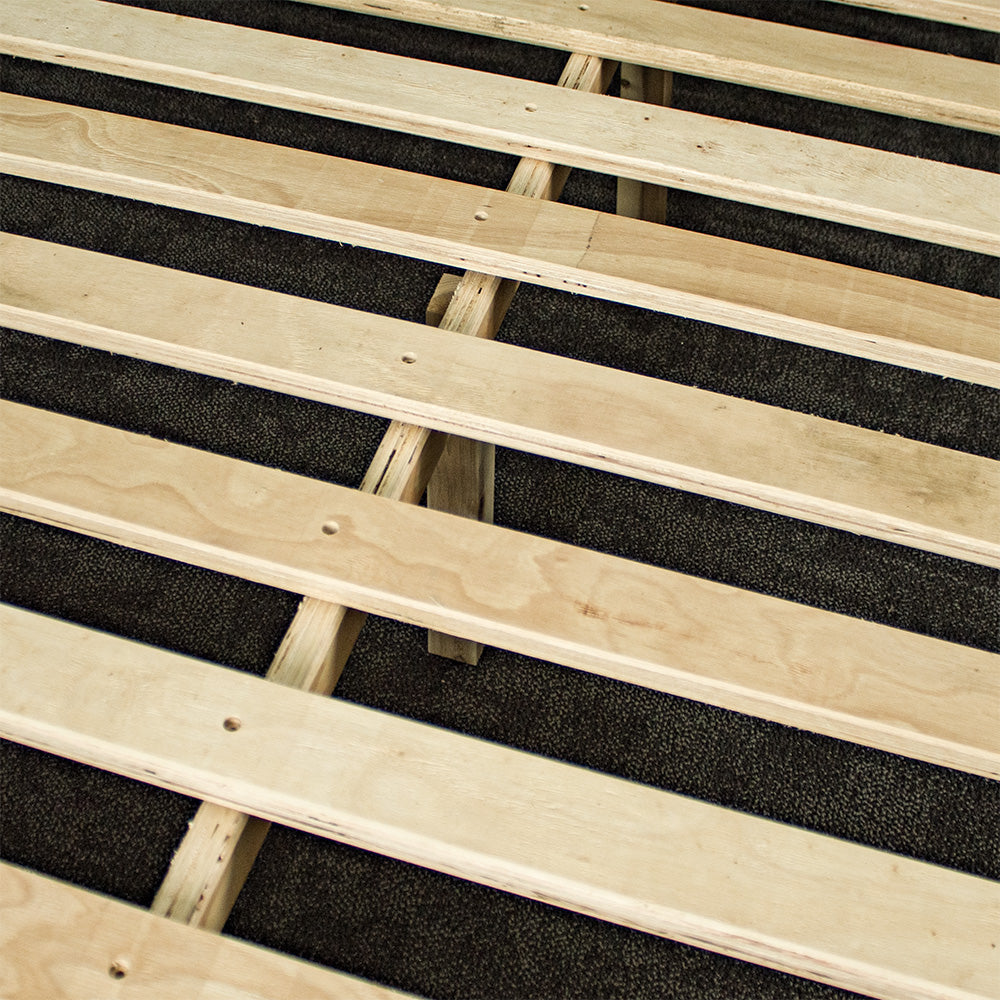 A closer view of the slats and wooden support bar on the Mars King Single Slat Bed Frame.