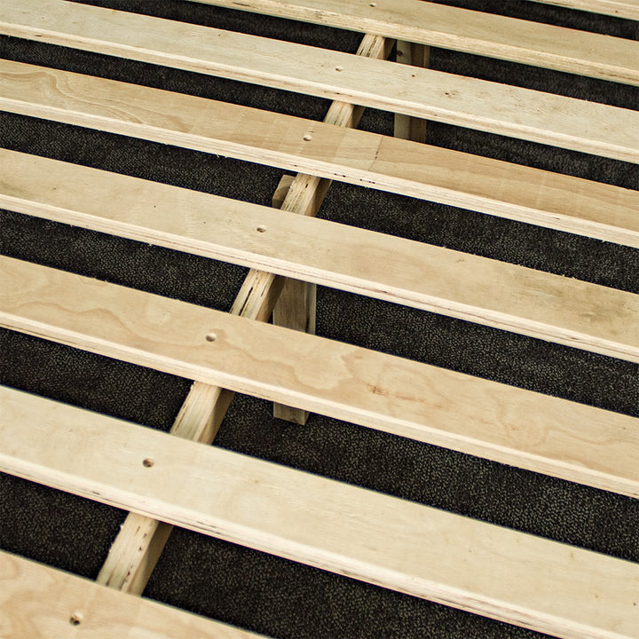 A closer view of the slats and wooden support bar on the Mars King Single Slat Bed Frame.