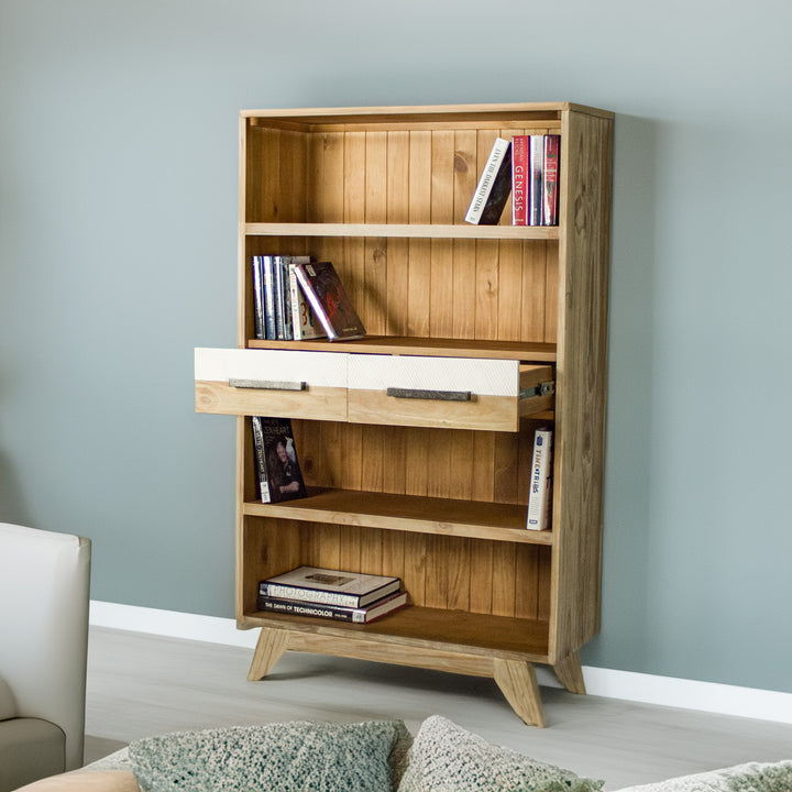 The front of the Soho Medium Bookcase with its drawers open. There are books on each shelf.