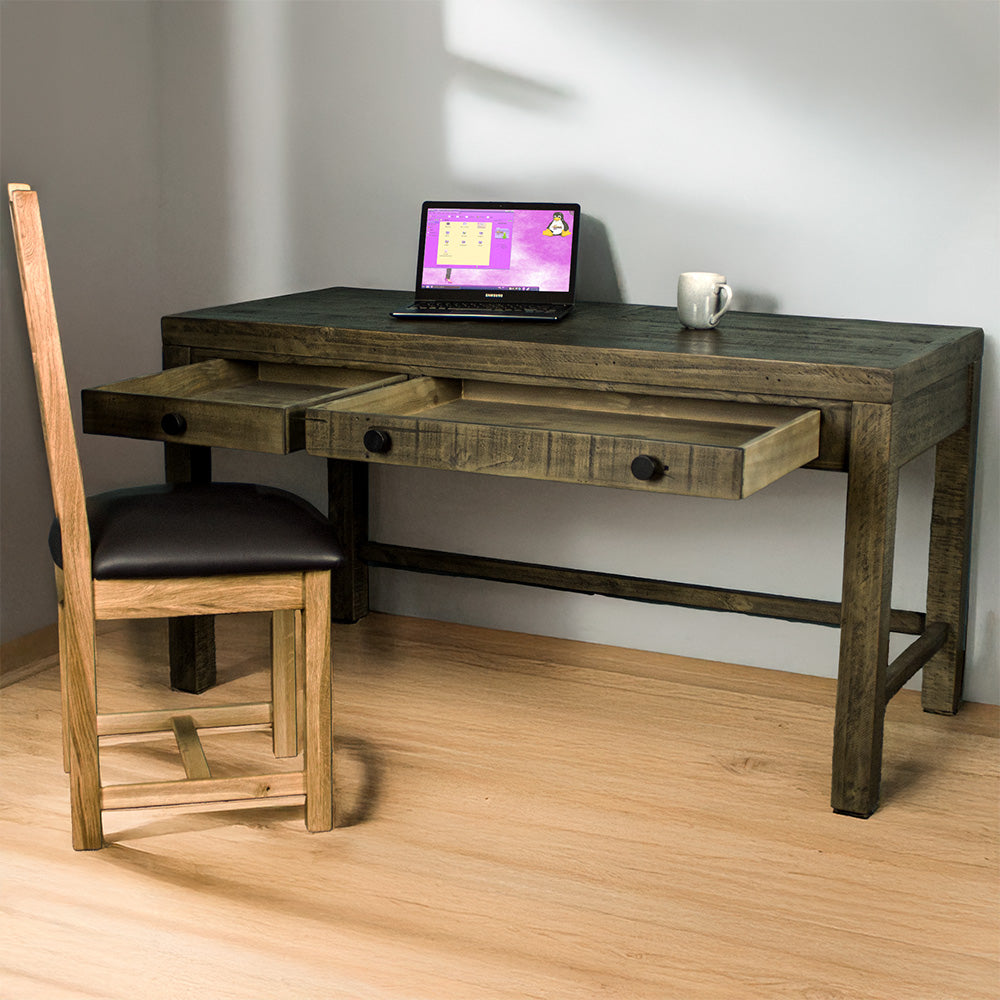 Front of the Stonemill Recycled Pine Desk with its two drawers open. There is an oak leather chair in front and a laptop and coffee mug on top.