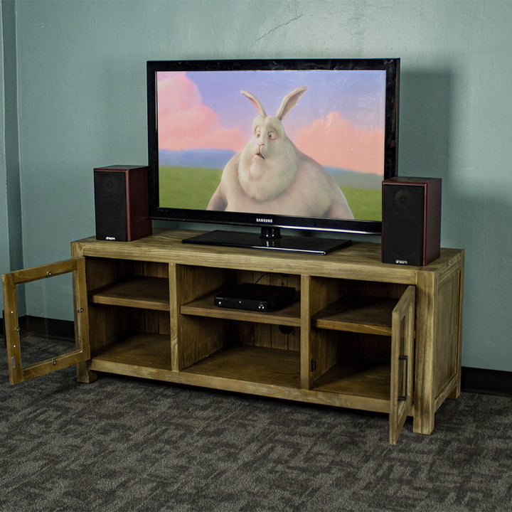 The front of the Vancouver 2 Door Entertainment Unit / TV Unit with its doors open. There is a large TV on top with two speakers on either side. There is a DVD player on the top shelf in the middle of the unit.