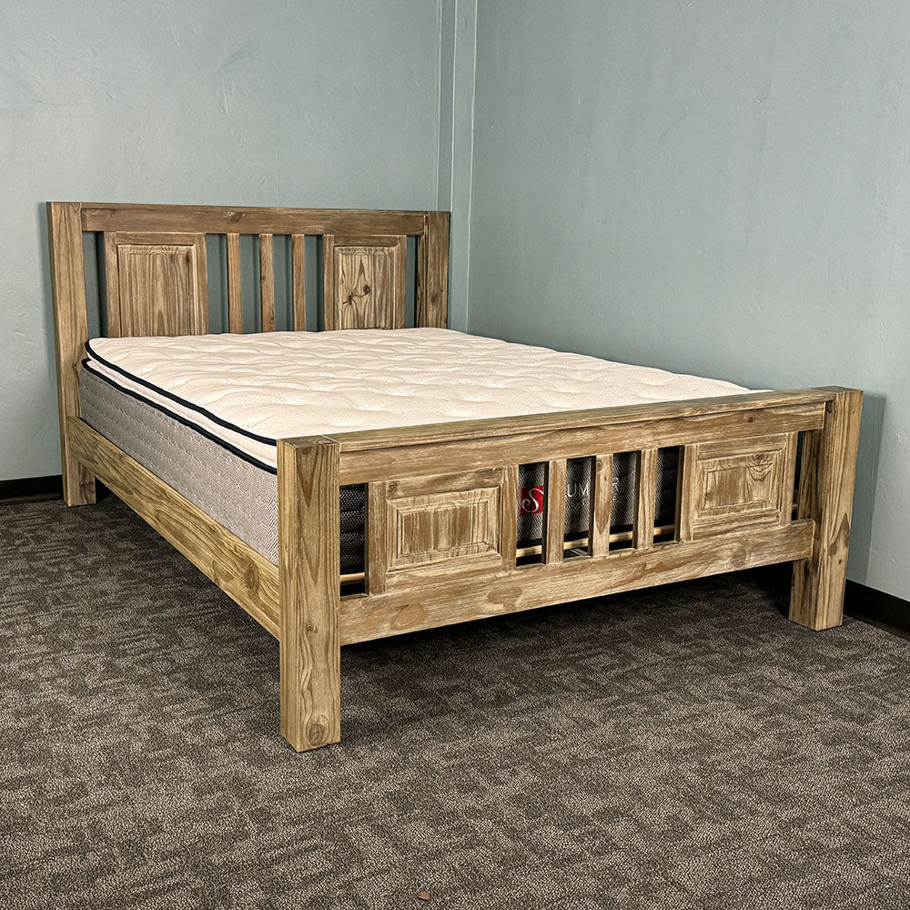 The front of the Vancouver Queen Size NZ Pine Slat Bed Frame with a mattress on top.