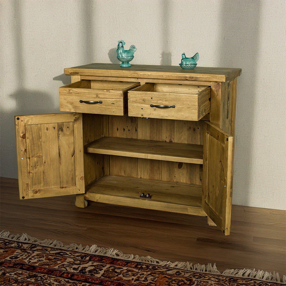 The front of the Ventura Recycled Pine Buffet with its drawers and doors open. There are two blue glass ornaments on top.