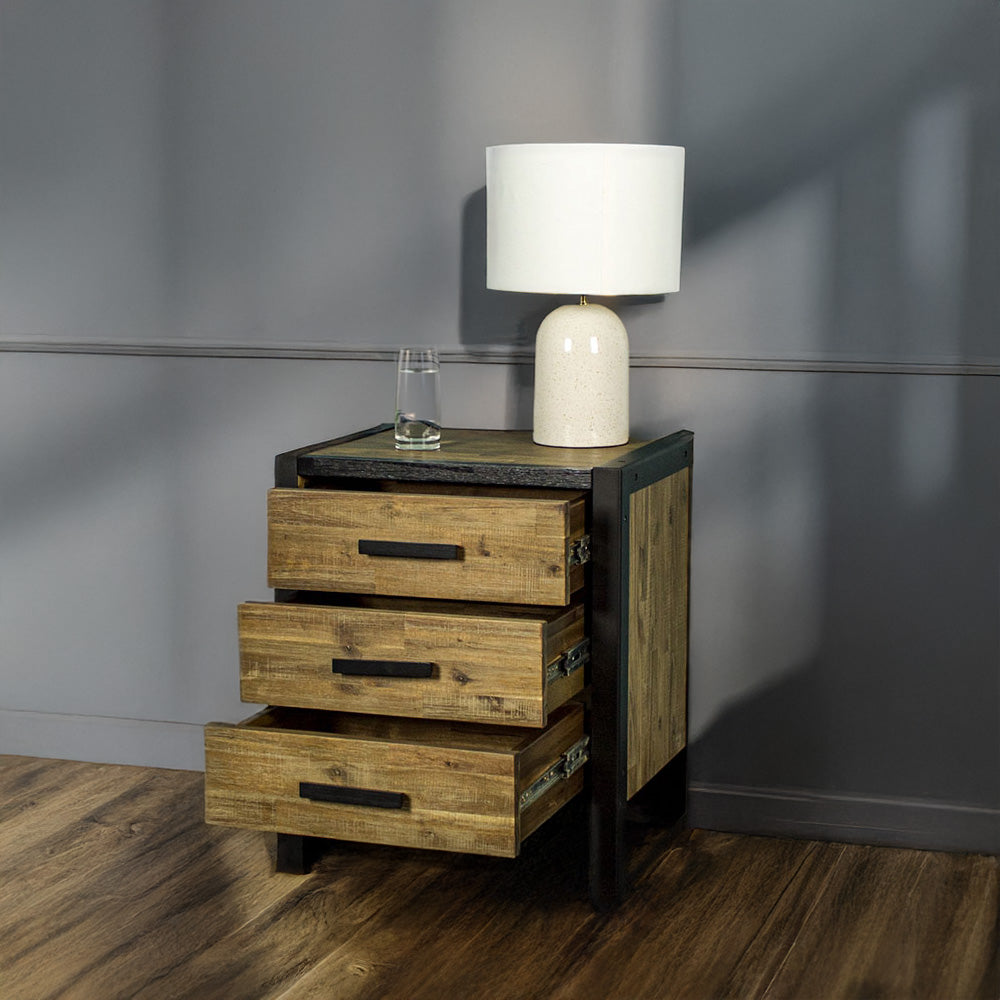 Front of the Victor 3 Drawer Bedside Cabinet with its drawers open. There is a glass of water and a lamp on top.