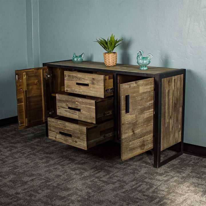 The front of the Victor 2 Door 3 Drawer Sideboard with its doors and drawers open. There are two blue glass ornaments on top with a potted plant in between.