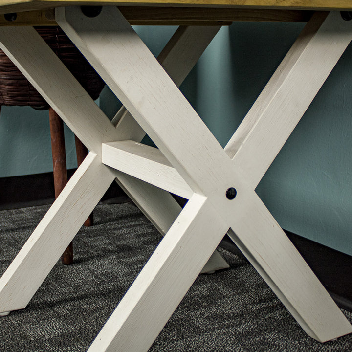 A close up of the cross legs and the wooden support bar in the middle of the Byron Recycled Pine Lamp Table