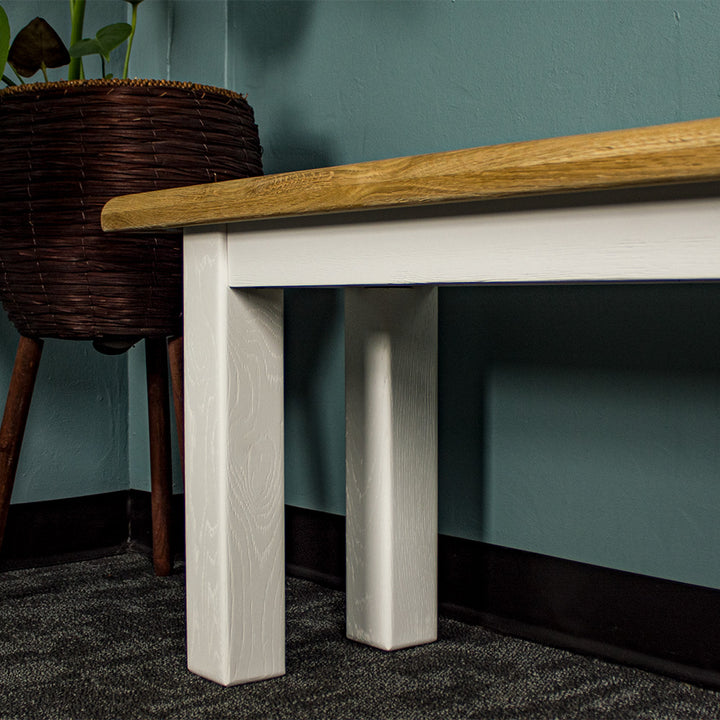 A closer view of the legs on the Loire Solid Oak Bench Seat (White).