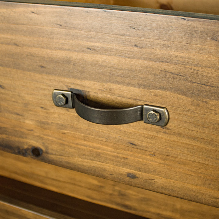 A close up of the handles on the drawers of the Botanica Six Drawer Tallboy.