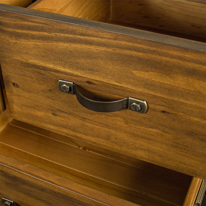 A close up of the metal handles on the drawers of the Botanica Large Seven Drawer Lowboy.