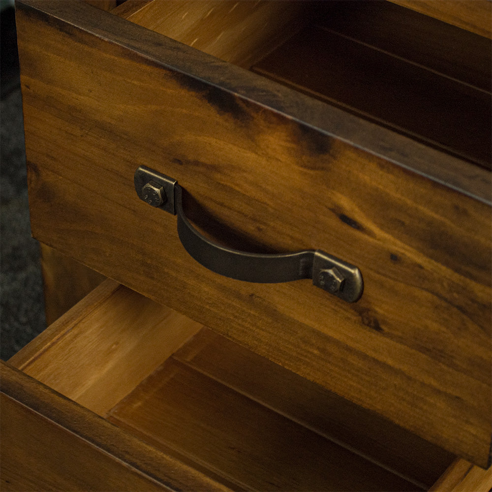 A close up of the metal handles on the drawers of the Botanica Bedside Cabinet.