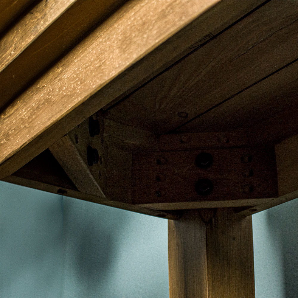 Under the Cairns Recycled Pine Hall Table, showing the bolts that secure the legs to the table.