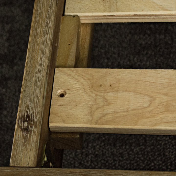 A close up of the slots that securely fasten the slats to the Mars Queen Slat Bed Frame.