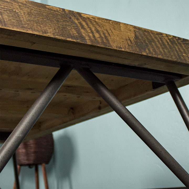 Close up of the braces for the black metal cross legs of the Paddington Recycled Pine Coffee Table.