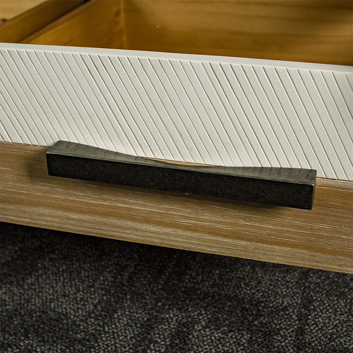 A close up of the handle on the drawers of the Soho NZ Pine Display Cabinet.