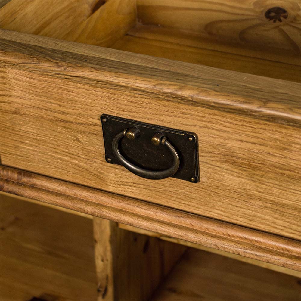 A close up of the brushed black metal handle on the Yes 3 Door 3 Drawer Oak Buffet.