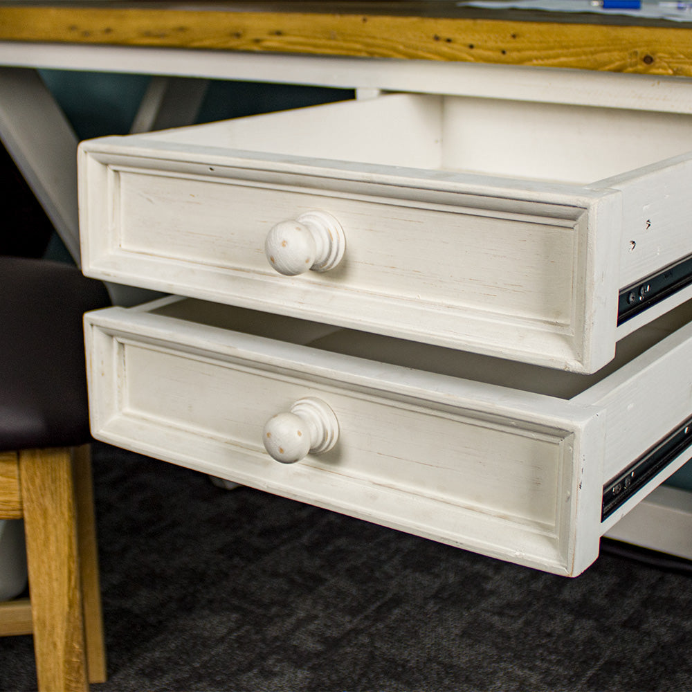 A close view of the door knob style handles on the drawers of the Byron Recycled Pine Desk.