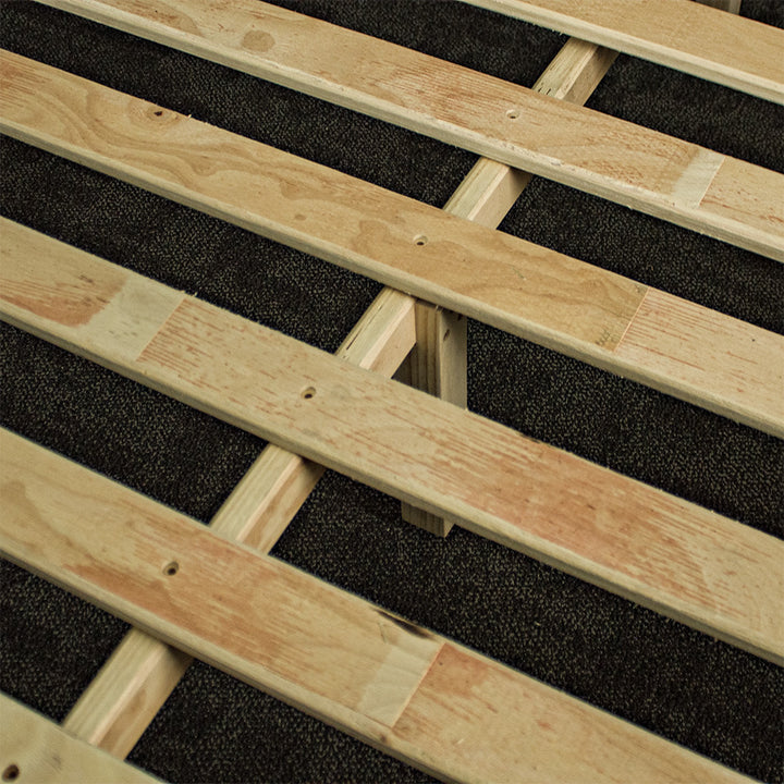 A close up of the wooden slats, with the wooden support rail and legs underneath.