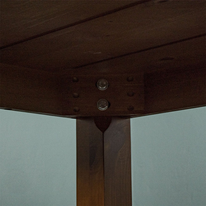 A close up of the bolts that securely hold the legs to the Hamilton Dining Table with Rimu Finish (1200mm)