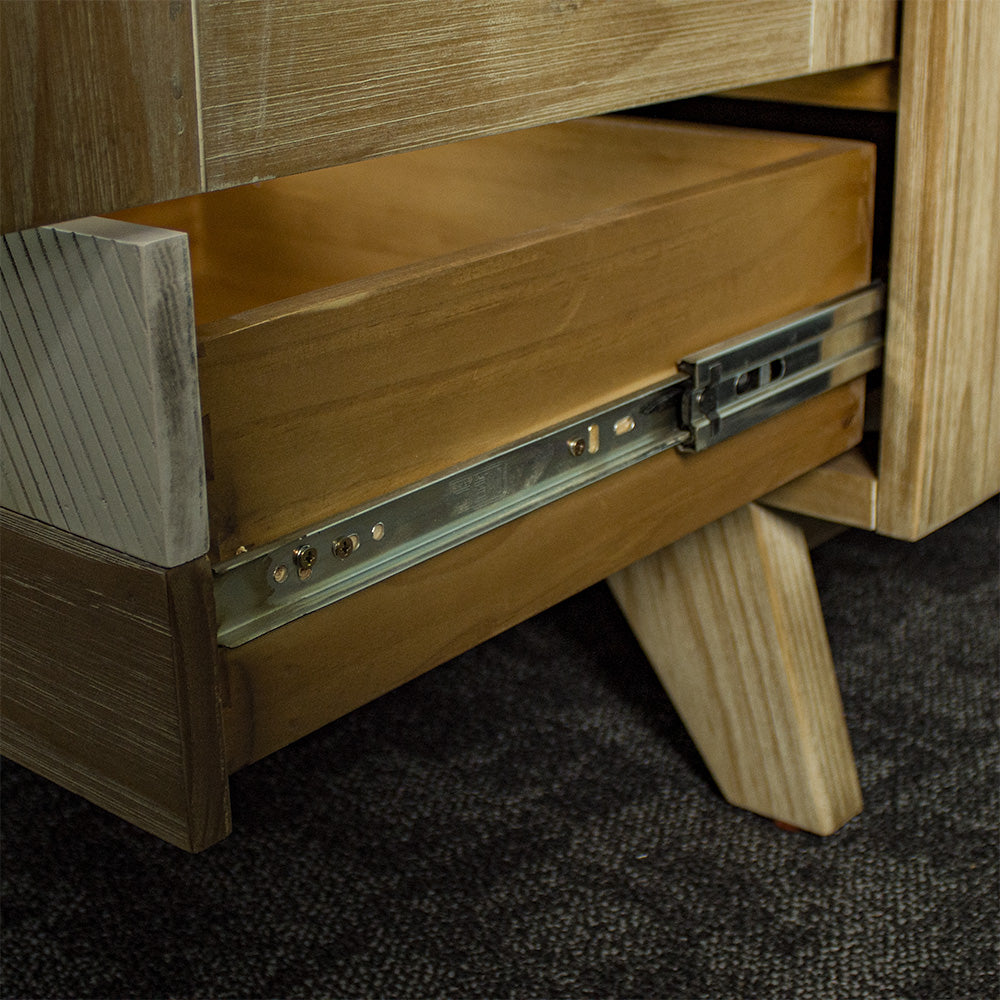 A close view of the sturdy metal runners on the drawers of the Soho NZ Pine Display Cabinet.