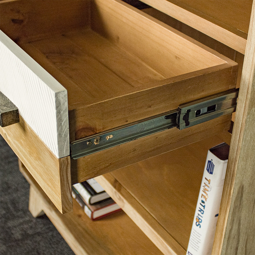 A close up of the smooth runners on the drawers of the Soho Medium Bookcase.