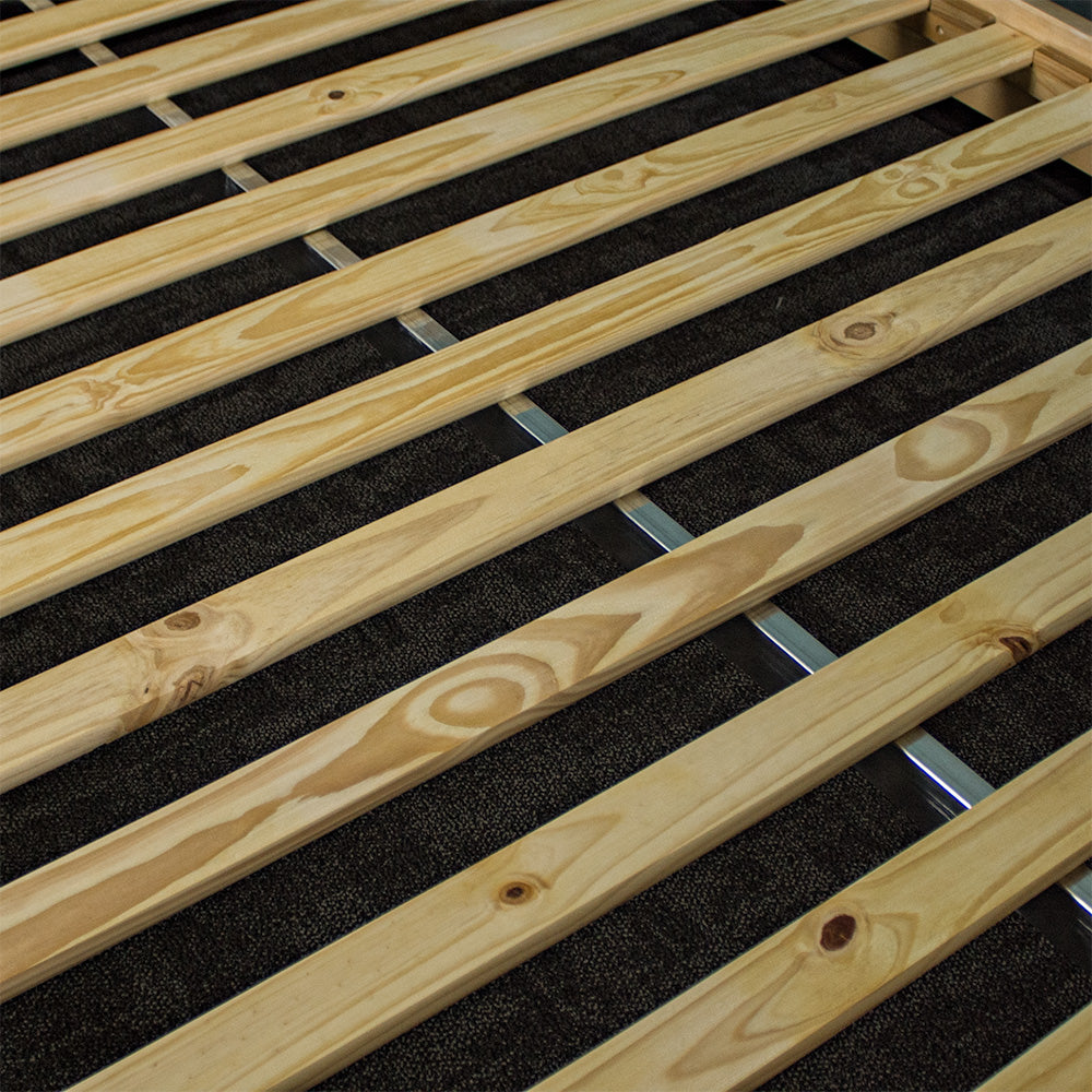 A close view of the slats of the Soho Queen Size Slat Bed Frame with the metal support beam running underneath.