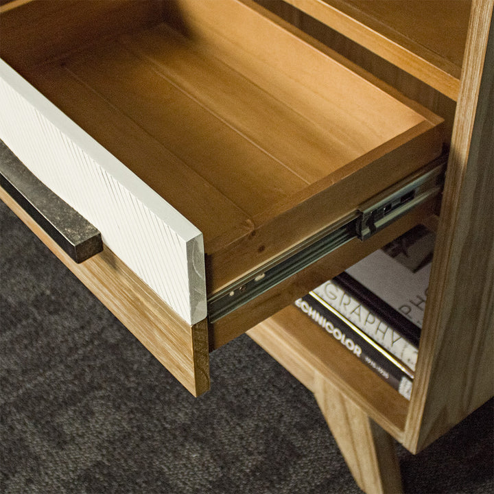 A close view of the runners on the drawers of the Soho Short Display Shelf.