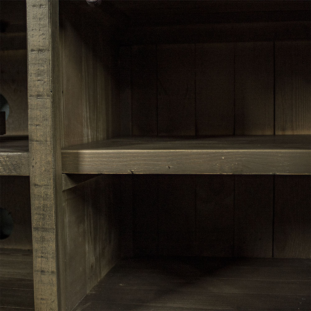 A close up of the removable shelf on the sides of the Stonemill Recycled Pine TV Unit 