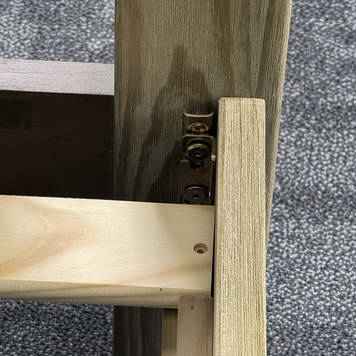 A close up of the bolts that secure the frame of the Vancouver Queen Size NZ Pine Slat Bed Frame.