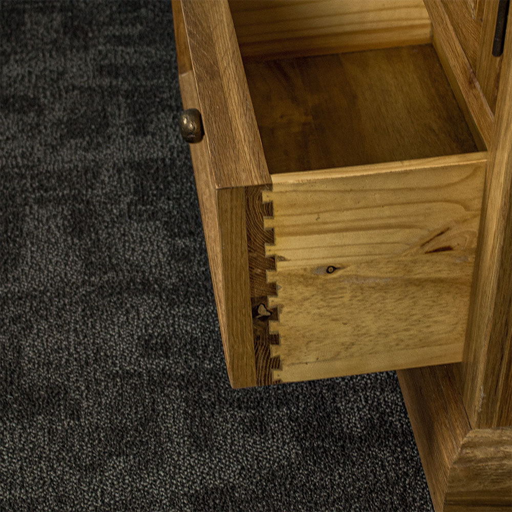 The side of the drawer on the Versailles Small Display Cabinet, which has strong dovetail joinery.