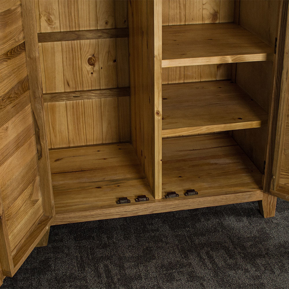 The lower shelving units of the Vienna Oak Large Wardrobe.