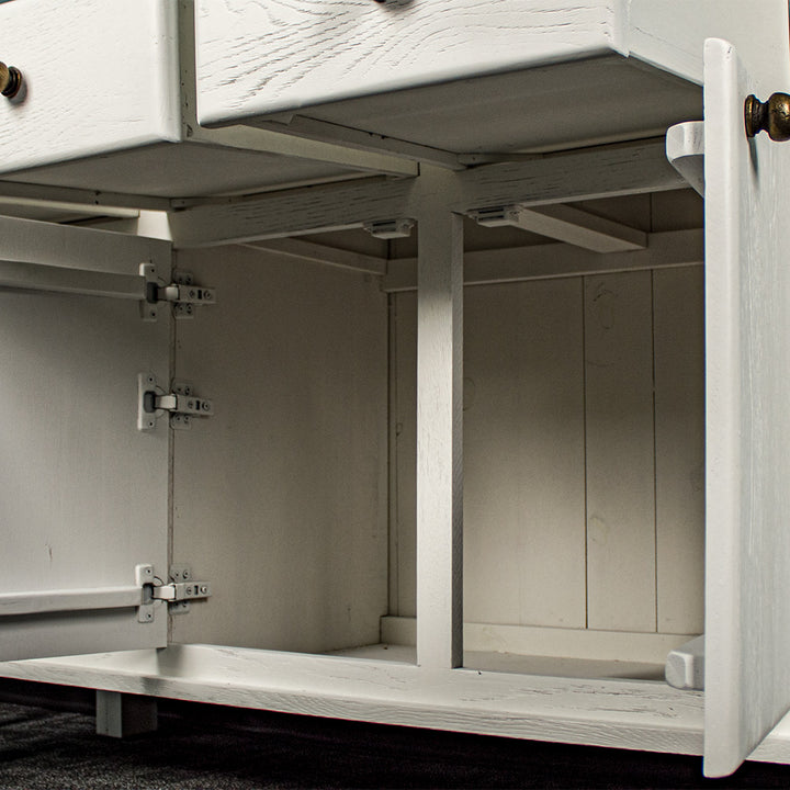 A view of behind the doors on the Loire Two-Tone Medium Oak Buffet.