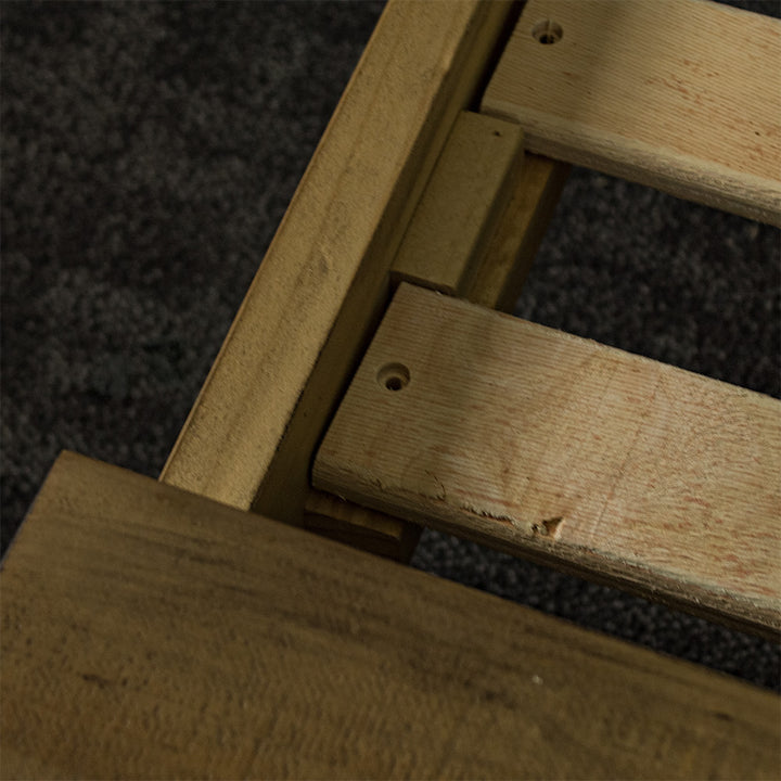 A close up of the hole to secure the slats to the Amarillo Queen Slat Bed Frame.