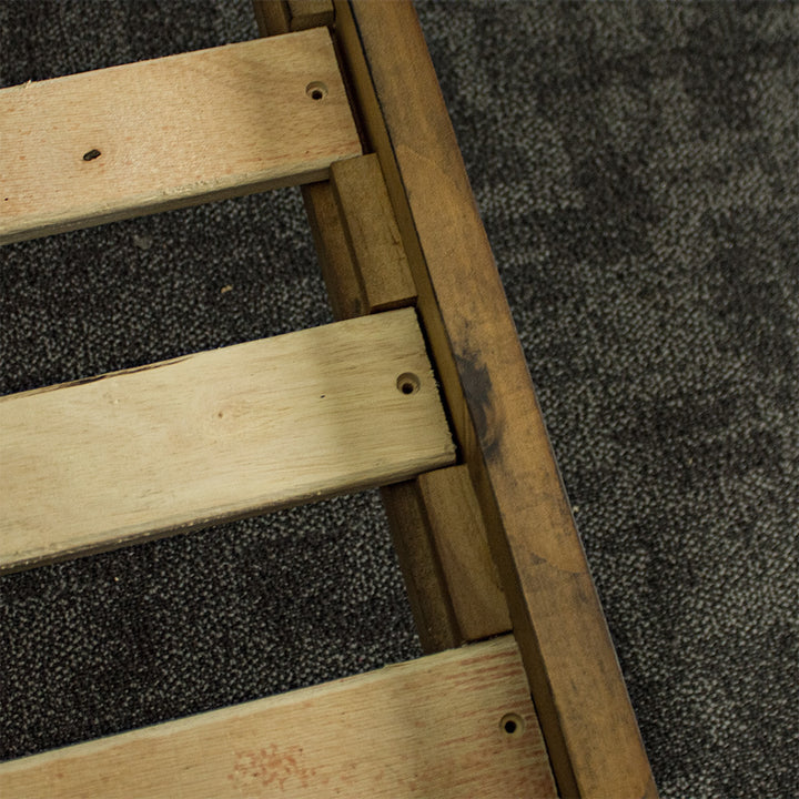 A close up of the guides to securely fasten the slats to the Botanica King Slat Bed Frame.