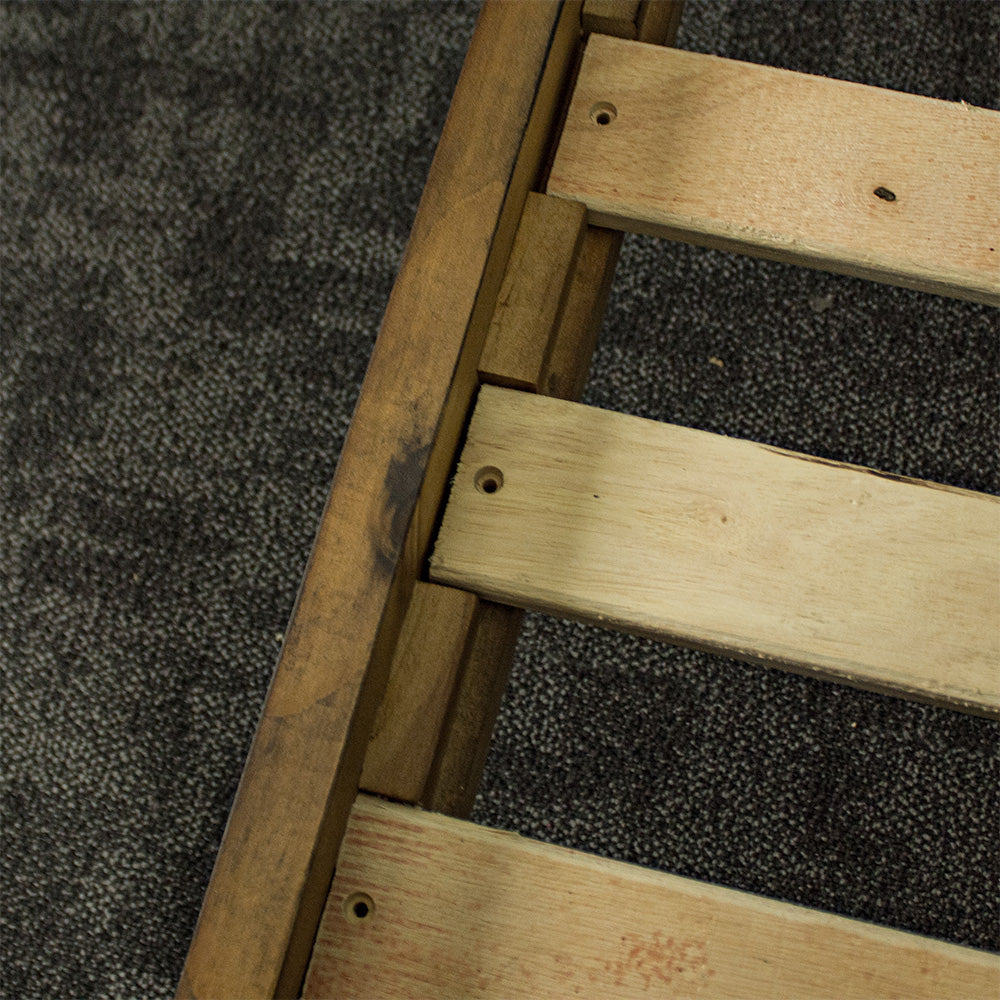 A close up of the slots to securely fasten the slats to the Botanica Queen Slat Bed Frame.