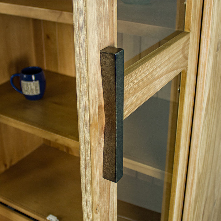 A close up of the handle on the doors of the Soho NZ Pine Display Cabinet